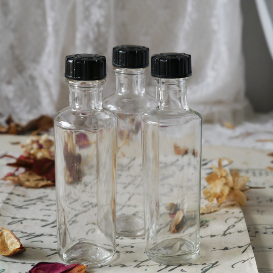 Set Of Three Vintage Glass Bottles With Lids