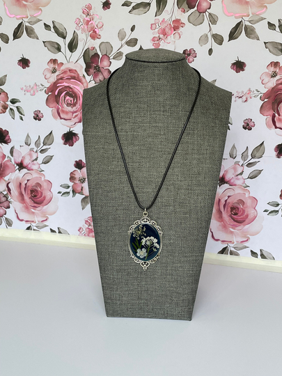 Real Dried White Flowers With Leaves in Resin Pendant A Dark Blue Embossing Powder Background