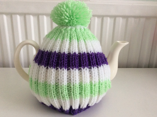 striped Hand Knitted Tea Cosy in Spring Green, White & Purple, A Perfect Gift For Your Teapot