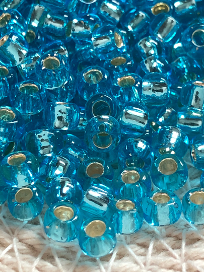 New Toho Round Seed Beads, 6/0, Silver - Lined Aquamarine, | Tr-06-23, Qty 20 Grams, 4mm Beads