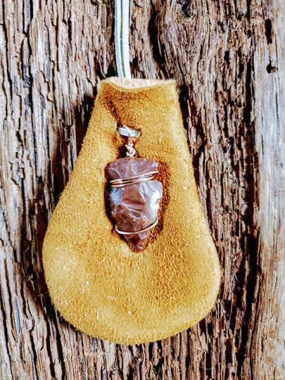 stone Arrowhead On Elk Hide