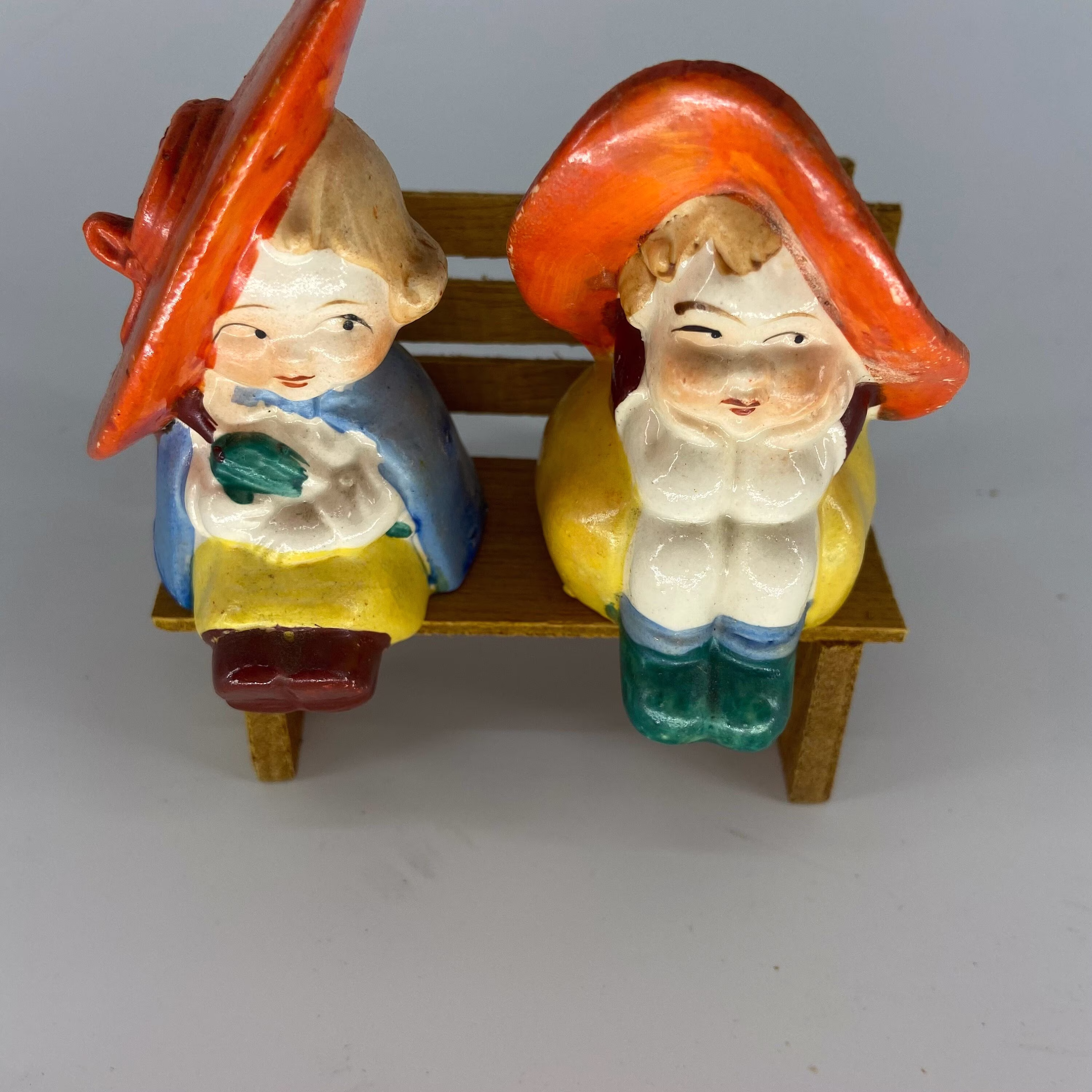 Boy & Girl Sitting On Bench Ceramic Salt Pepper Shakers New